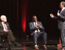 Founding Partner Antonio M. Romanucci flips a coin to determine who will go first between mayoral run-off candidates Brandon Johnson and Paul Vallas.